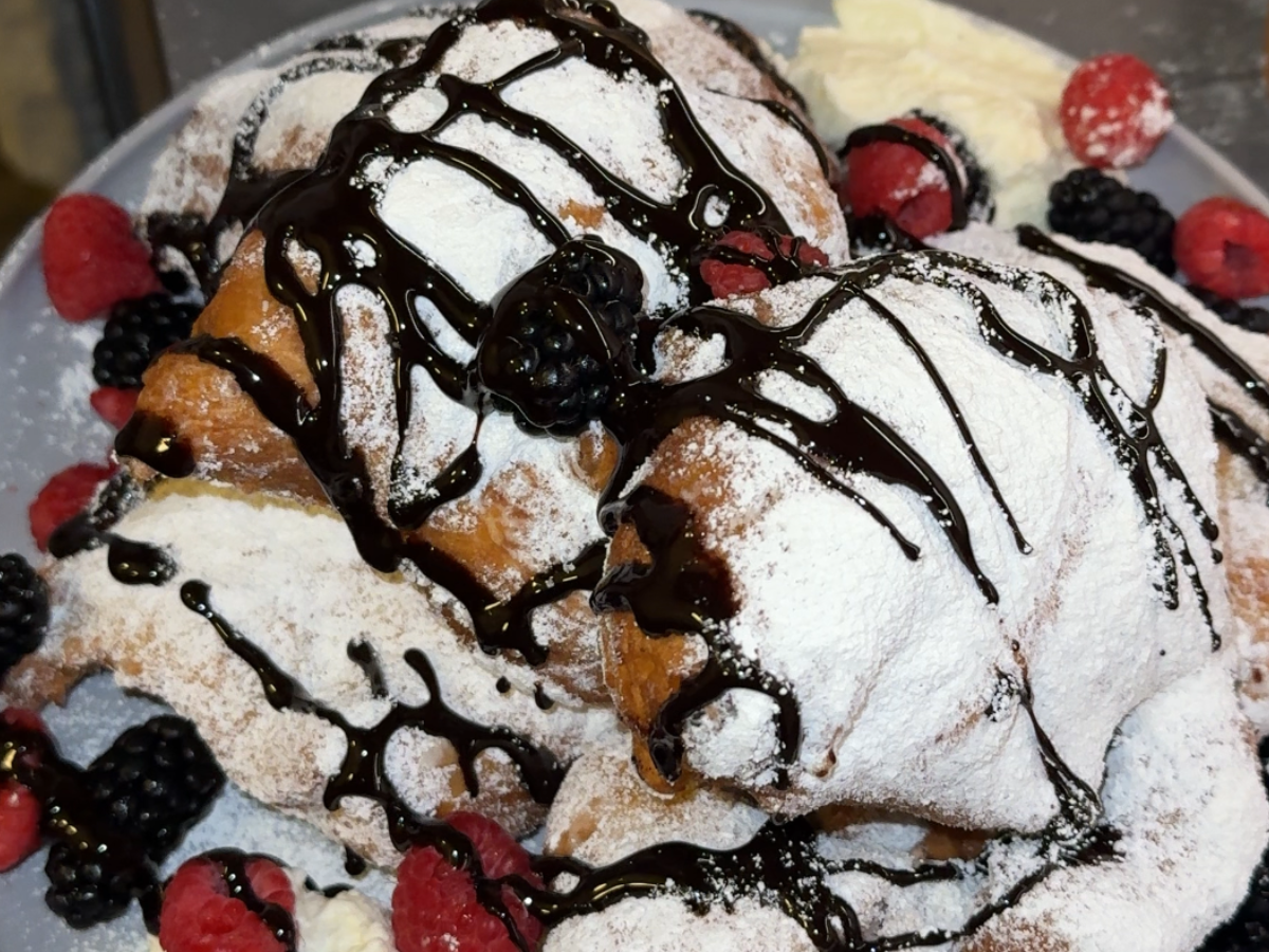 Fresh beignets dusted with powdered sugar