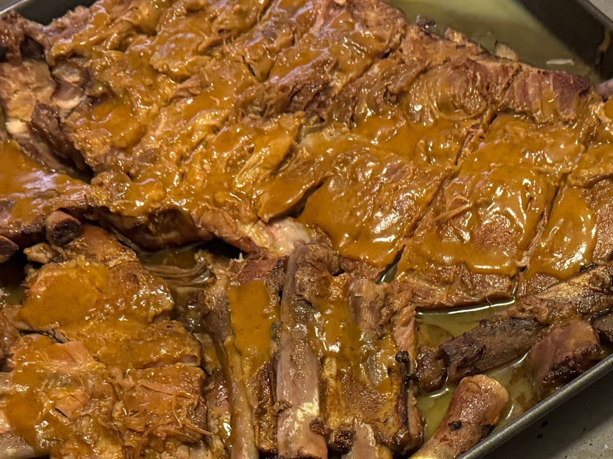 A rack of ribs glazed with Carolina gold BBQ sauce